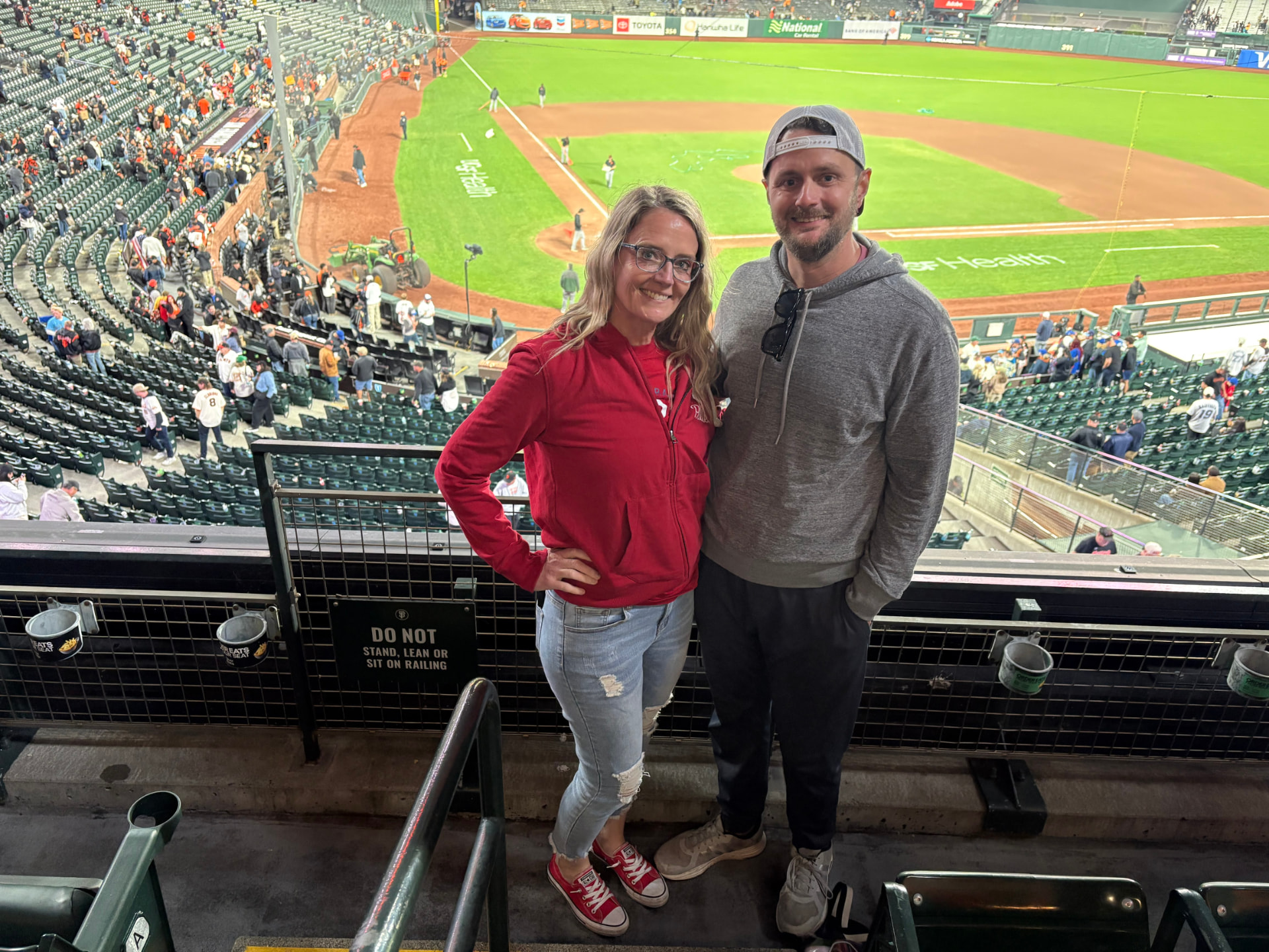 Jeff and his wife at a baseball game